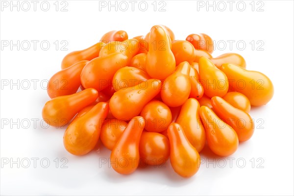 Bunch of small ripe orange grape tomatoes isolated on white background. side view, close up