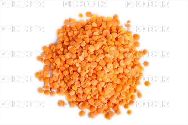 Pile of red lentils isolated on white background. Top view