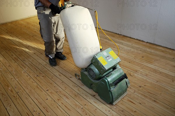 A parquet floor is sanded and oiled