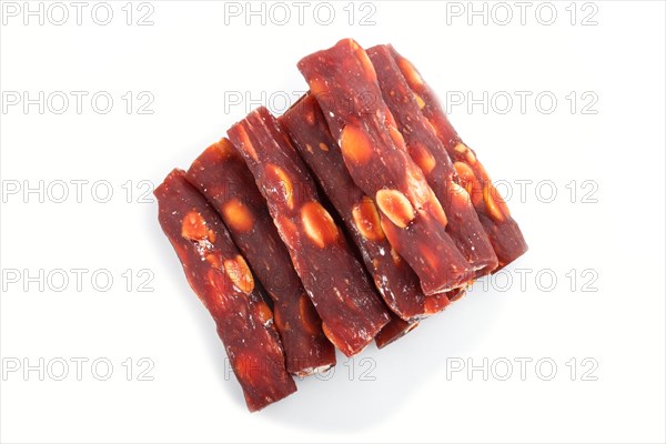 Brown traditional turkish delight (rahat lokum) with peanuts isolated on white background. top view, flat lay, close up