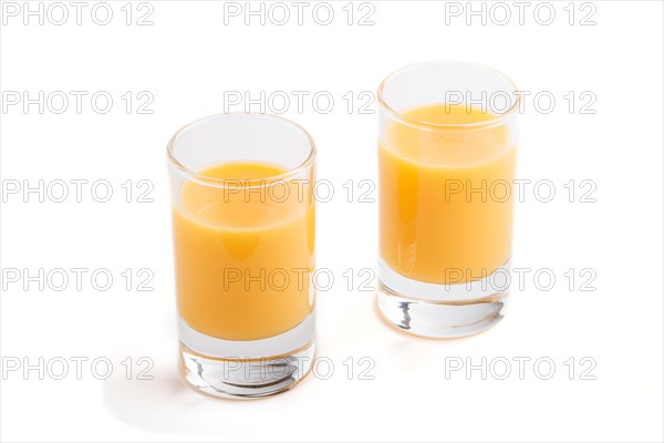 Sweet egg liqueur in glass isolated on white background. Side view, close up