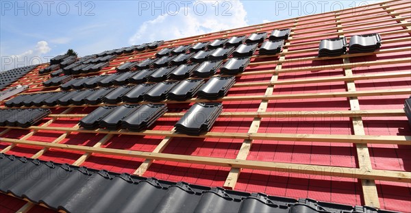 Panoramic image of the roof covering of a new tiled roof on a residential building