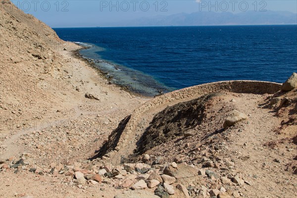 The coastline of the Red Sea and the mountains in the background. Egypt, the Sinai Peninsula, Dahab