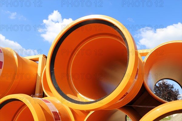 Stack of KG pipes on a construction site in the Mutterstadt development area, Rhineland-Palatinate