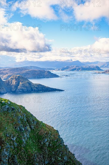 View of a fjord landscape with a rocky coast on the Norwegian coast, Runde, Heroy, Norway, Europe