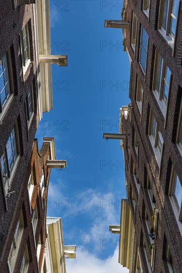 Row of houses with pulleys, architecture, Middle Ages, trade, trading city, warehouse district, facade, city centre, city trip, Amsterdam, Netherlands