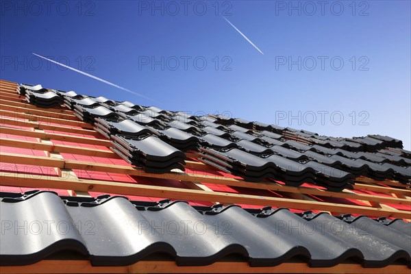 Roofing work, re-roofing of a tiled roof