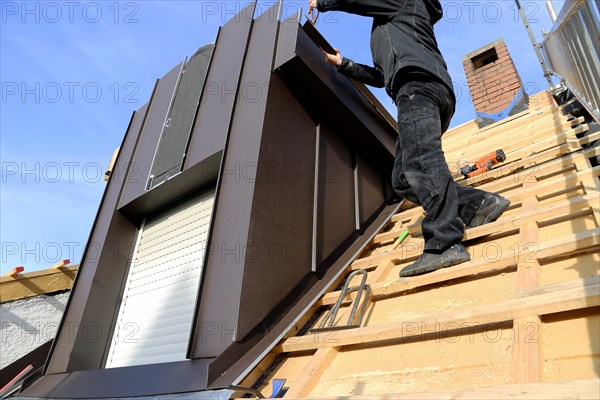 Roofer working on a new dormer window