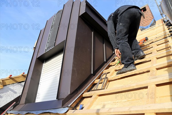 Roofer working on a new dormer window