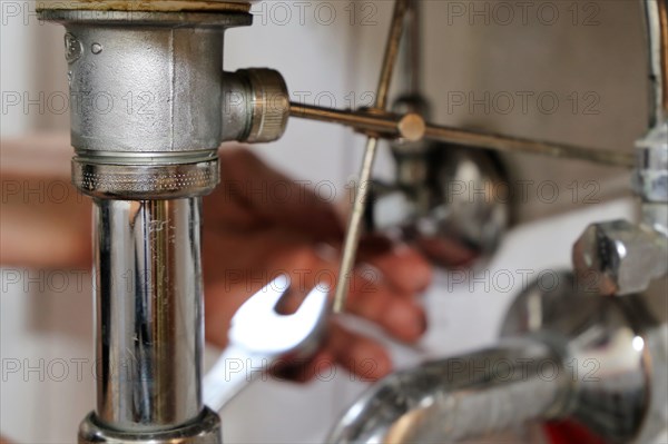 Close-up of sanitary work on a washbasin