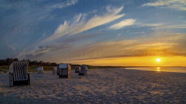 Sunset in Prerow on the Darss with beach chairs