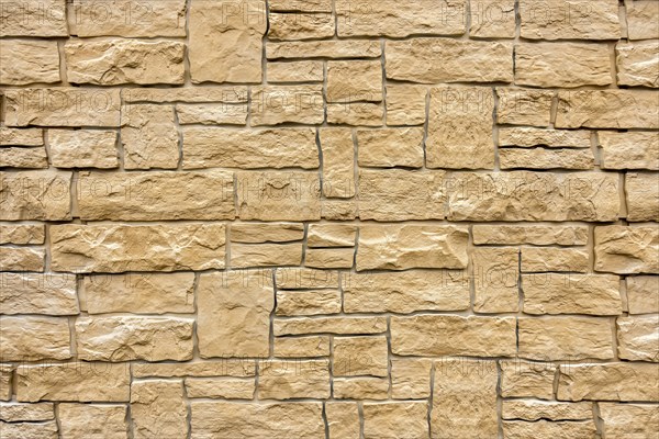 Artificial stone wall, imitation natural stone made of synthetic material, plastic, pattern, structure, background, wallpaper
