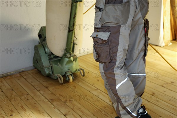 A parquet floor is sanded and oiled