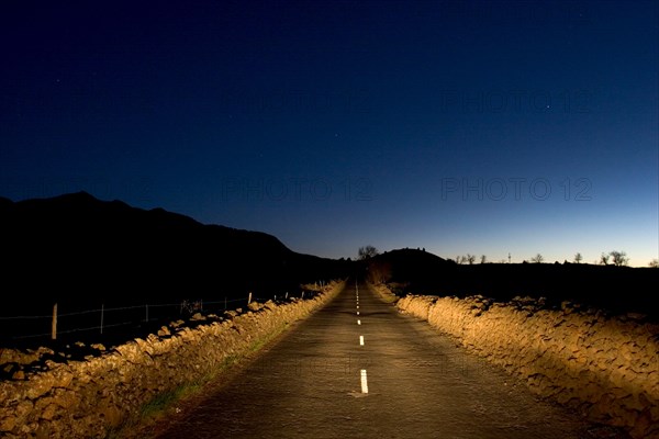 Deserted rural road in the night, headlight of a car, near Los Llanos, La Palma, Canary Islands, Spain, Europe