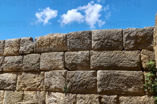 Detail of an old stone wall with visible stone structures, Archaeological site, Ancient Messene, capital of Messinia, Messini, Peloponnese, Greece, Europe
