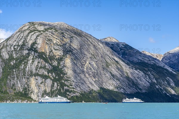 Cruise ship Stella Australis and sister ship Ventus Australis anchored between ice floes in Pia Bay in front of Pia Glacier, Alberto de Agostini National Park, Avenue of Glaciers, Chilean Arctic, Patagonia, Chile, South America