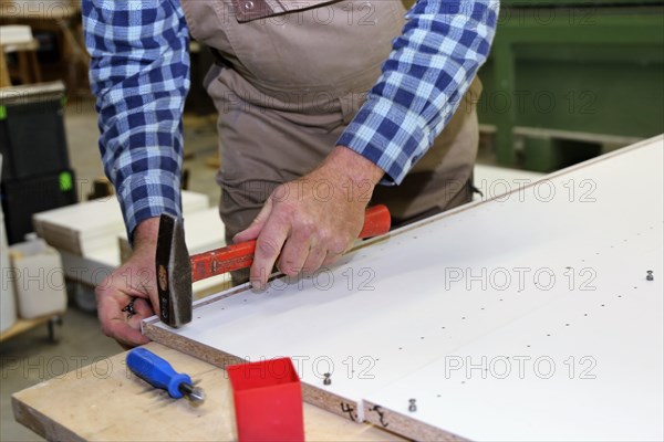 Carpenter at work in his carpentry workshop