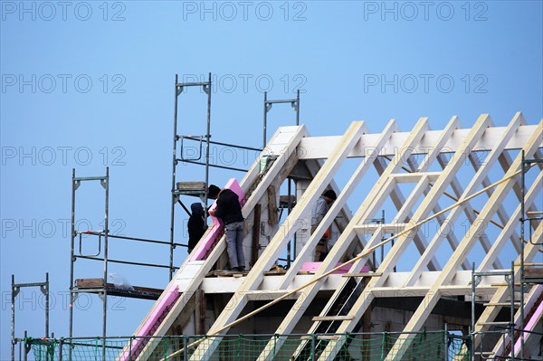 Carpentry work on a residential building under construction