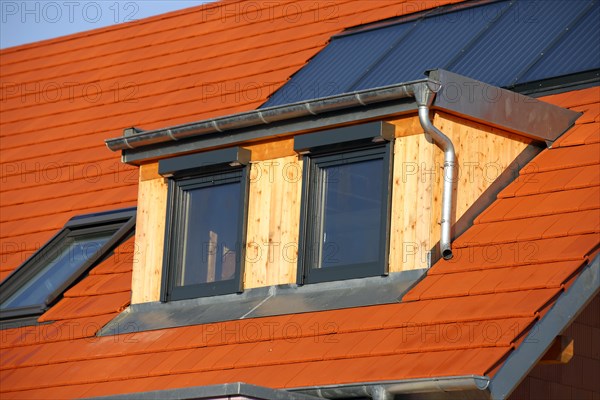 Roofer working on a new dormer window