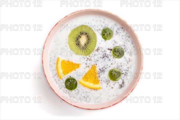 Yogurt with kiwi, gooseberry, chia in ceramic bowl isolated on white background. top view, close up