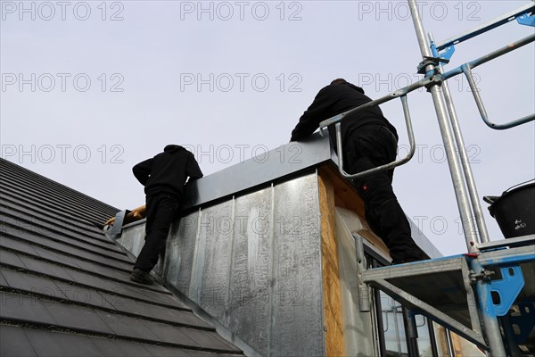 Roofer working on a new dormer window