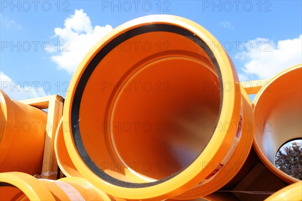 Stack of KG pipes on a construction site in the Mutterstadt development area, Rhineland-Palatinate