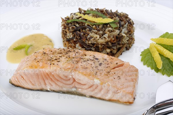 Southern German cuisine, fillet of Dreisam salmon with wild rice and lemon sauce, salmon fillet, healthy eating, decoration, lemon peel, herbs, lemon balm, food plate, fish cutlery, appetising, food, studio, fish dish, cooking, Germany, Europe