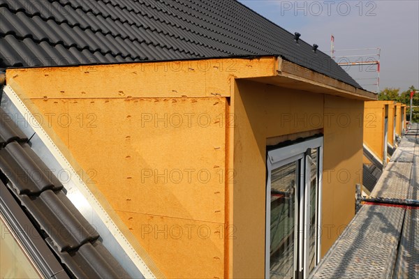 Roofer working on a new dormer window