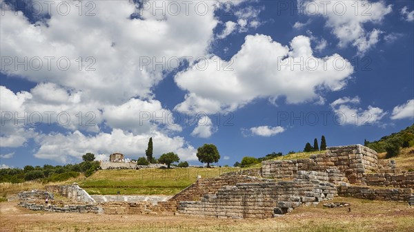 Historic remains of walls under a vibrant sky, surrounded by natural landscape, Archaeological site, Ancient Messene, Capital of Messinia, Messini, Peloponnese, Greece, Europe