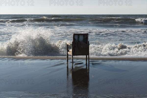 Upholstered chair washed up on the North Sea shore, flotsam, Oksbol, Region Syddanmark, Denmark, Europe