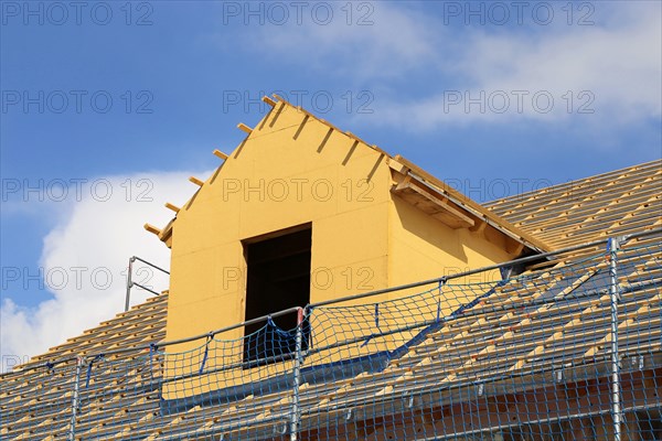 Roofer working on a new dormer window