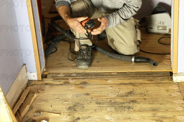 A parquet floor is sanded and oiled