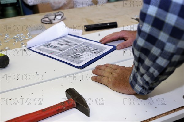 Carpenter at work in his carpentry workshop