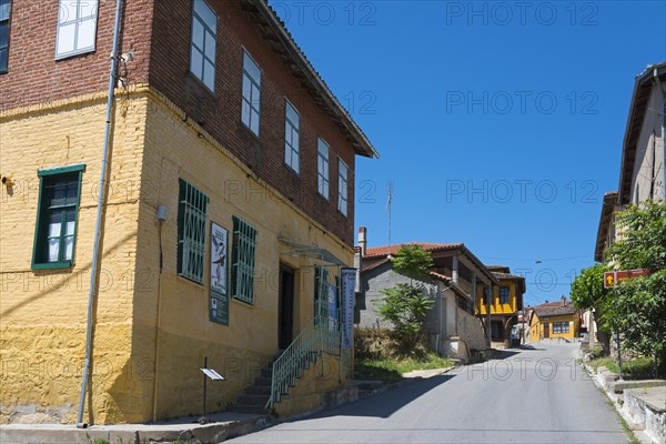 Charming cobbled street with rustic, colourful houses in an old town, Koukoulospito, house with traditional architecture built for rearing silkworms, museum, Soufli, Eastern Macedonia and Thrace, Greece, Europe