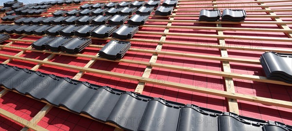 Panoramic image of the roof covering of a new tiled roof on a residential building