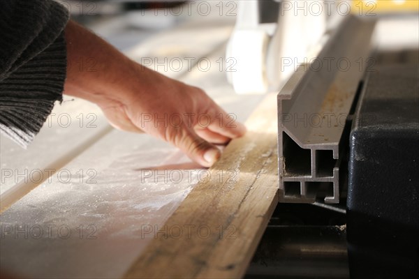 Carpenter at work in his carpentry workshop