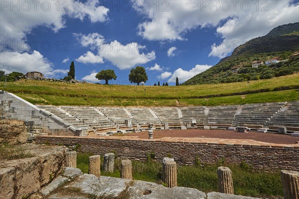 View of an amphitheatre with surrounding trees and mountains in the background, Ancient Theatre, Archaeological Site, Ancient Messene, Capital of Messinia, Messini, Peloponnese, Greece, Europe