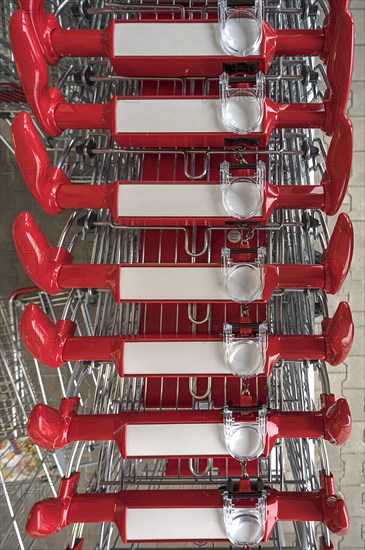 Shopping trolley with magnifying glass in front of a supermarket, Bavaria, Germany, Europe