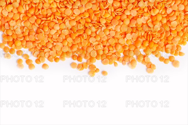 Texture of red lentils isolated on white background. Top view