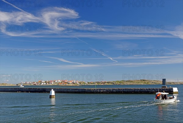 Small fishing boat in front of archipelago islands, summer, Oeckeroe, Gothenburg, Sweden, Europe