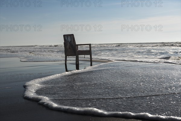 Upholstered chair washed up on the North Sea shore, flotsam, Oksbol, Region Syddanmark, Denmark, Europe