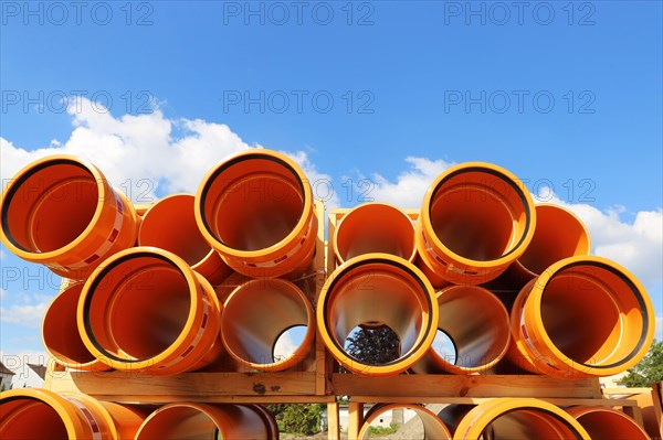 Stack of KG pipes on a construction site in the Mutterstadt development area, Rhineland-Palatinate