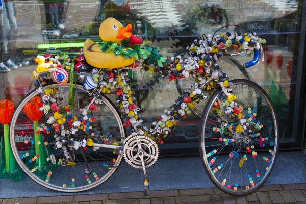 Colourfully decorated bicycle, decoration, symbol, symbolic, whimsical, mobility, Amsterdam, Netherlands