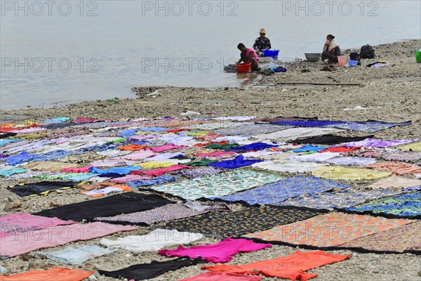 Washing clothes in the Irrawaddy, Myanmar, Asia