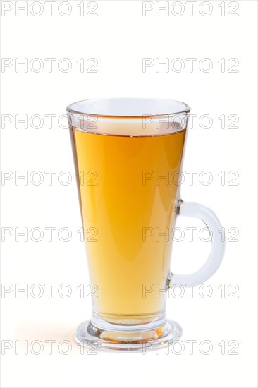 Glass of green grape juice isolated on white background. Morninig, spring, healthy drink concept. Side view, close up