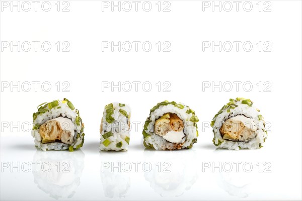 Four Japanese maki sushi rolls in a row with cream cheese and onion isolated on white background.Side view, close up