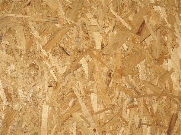 Yellow brown oriented strand board wood texture background