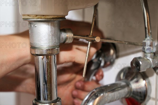 Close-up of sanitary work on a washbasin