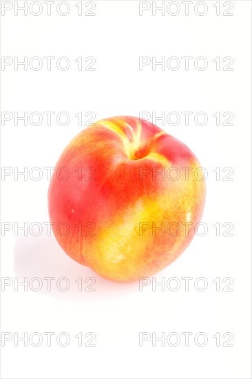 Nectarine isolated on white background. Side view, close up