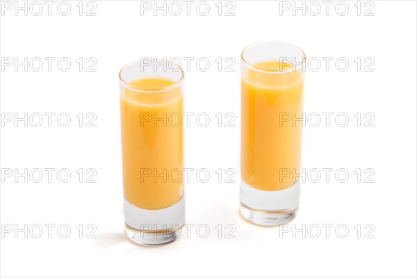 Sweet egg liqueur in glass isolated on white background. Side view, close up